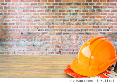 orange hard safety helmet construction hat for safety project of workman as engineer or worker 103911381