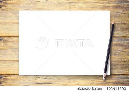 White blank paper or notepad with pencil on brown wood table background 103911390