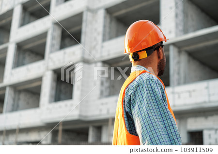 Close up of unrecognizable man foreman in workwear on construction site Close up of unrecognizable man foreman in workwear on construction site 103911509