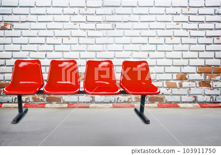 Background view from footpath with red chair old brick wall background and texture. 103911750