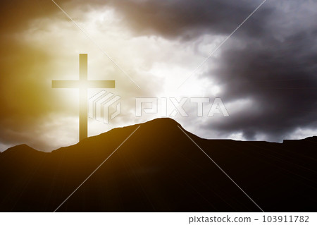 Silhouette cross on mountain sunset background 103911782