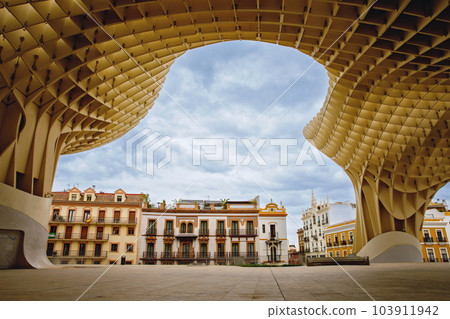 Metropol Parasol wooden structure located in the old quarter of Seville, Spain. Empty place without people. 103911942