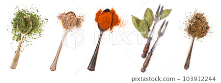 Different spices in retro spoons isolated on a white background 103912244