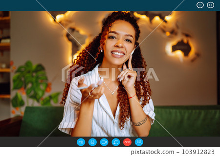 Headshot portrait screen view of young African American woman sit at home talk on video. 103912823