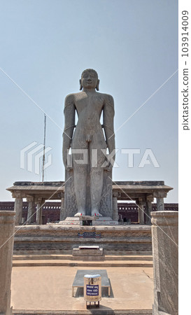 10 September 2021, Karkala, Karnataka, India. Tourist taking photograpgh of Karkala Gomateshwara statue built in 1432 CE by King Vir Pandya of Kalasa-Karkala dynasty. 10 September 2021, Karkala, Karnataka, India. Tourist taking photograpgh of Karkala Gomateshwara statue built in 1432 CE by King Vir Pandya of Kalasa-Karkala dynasty. 103914009