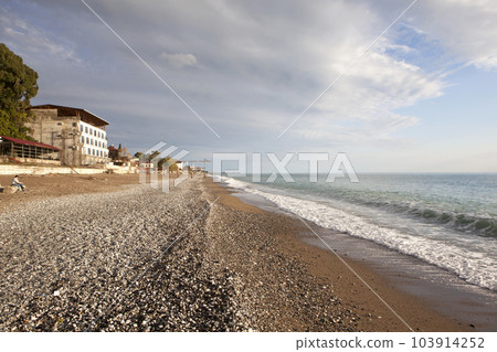 A picturesque panorama overlooking a deserted beach, sea and mountains. Gagra. Republic of Abkhazia A picturesque panorama overlooking a deserted beach, sea and mountains. Gagra. Republic of Abkhazia 103914252