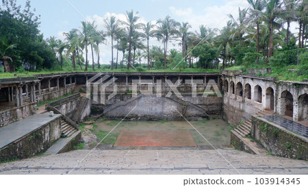 Stone faced tank with steps known a Koneru in Shri Rama Chandra temple, Ammapalli, Shamshabad, Telangana, India 103914345