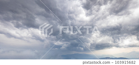 Heavy stormy gray clouds in the sky Heavy stormy gray clouds in the sky 103915682