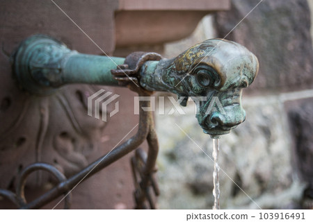 closeup of medieval fountain in Freiburg - Germany 103916491