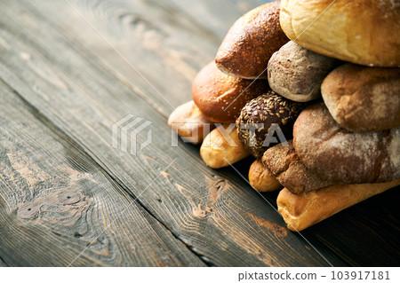 Different types of bread loaves close up with copy space. Different types of bread loaves close up with copy space. 103917181