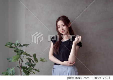 A woman with her arms crossed 103917821
