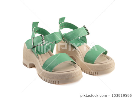 Women's leather sandals for hot weather isolated on white background. Women's leather sandals for hot weather isolated on white background. 103919596