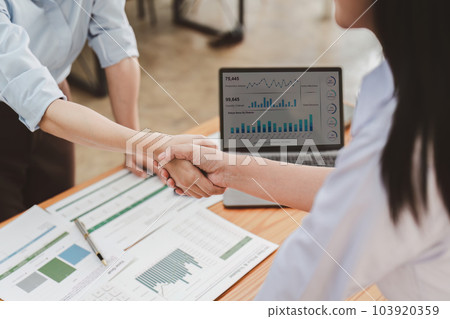 Business people handshake. Successful business team handshaking after good deal. Finishing up meeting concept Business people handshake. Successful business team handshaking after good deal. Finishing up meeting concept 103920359