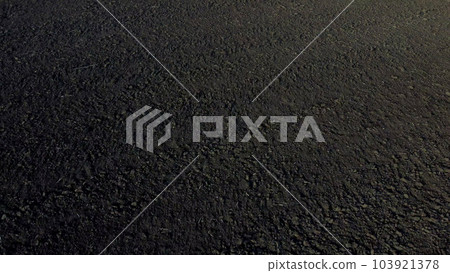 Landscape of plowed up land on agricultural field on sunny autumn day. Ground earth dirt priming. Flying over plowed earth with black soil. Black soil. Agrarian background. Aerial drone view. Landscape of plowed up land on agricultural field on sunny autumn day. Ground earth dirt priming. Flying over plowed earth with black soil. Black soil. Agrarian background. Aerial drone view. 103921378