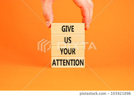 Give us your attention symbol. Concept words Give us your attention on wooden block. Beautiful orange table orange background. Motivational business give us your attention concept. Copy space. Give us your attention symbol. Concept words Give us your attention on wooden block. Beautiful orange table orange background. Motivational business give us your attention concept. Copy space. 103921896