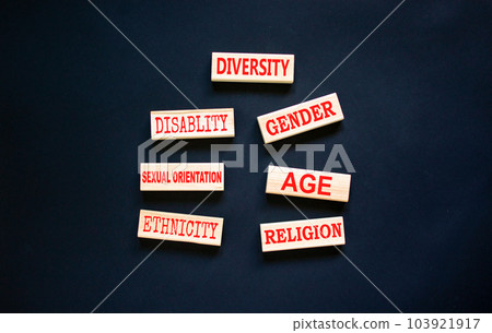 Diversity symbol. Diversity ethnicity gender age sexual orientation religion disability words written on wooden block. Beautiful black background. Equality and diversity concept. Copy space. 103921917