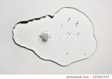 Sample drop of cosmetic product with blue particles 103922547