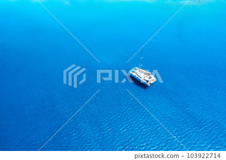 Drone view of a sailing yacht. Luxury transportation. Vacationing people. Vacation and holidays. 103922714