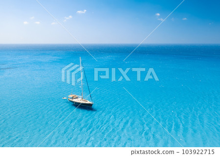 Drone view of a sailing yacht. Luxury transportation. Vacationing people. Vacation and holidays. 103922715