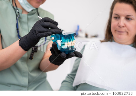 Dental doctor use model of jew during dental consultations to visually demonstrate treatment at dental clinics.  Dental doctor use model of jew during dental consultations to visually demonstrate treatment at dental clinics.  103922733