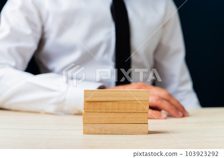 Stack of four blank wooden pegs Stack of four blank wooden pegs 103923292