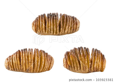 Crispy roasted hasselback potato isolated on white background. Crispy roasted hasselback potato isolated on white background. 103923381