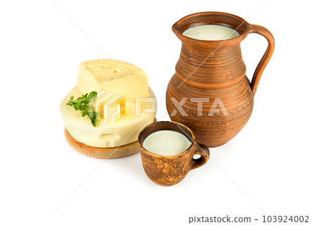 Cheese,milk in earthenware jug and mug isolated on white . Cheese,milk in earthenware jug and mug isolated on white . 103924002