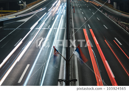 Light trails of cars captured with long exposure Light trails of cars captured with long exposure 103924565
