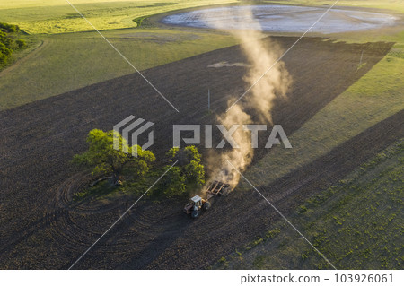 Tractor plowing the field, Pampas countryside, La Pampa, Argentina. 103926061