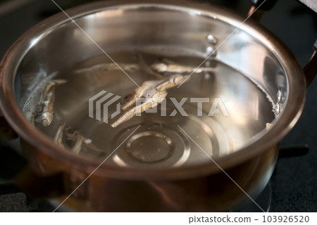 dried sardines in a pot 103926520