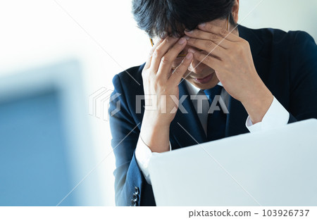Worried businessman Worried businessman 103926737