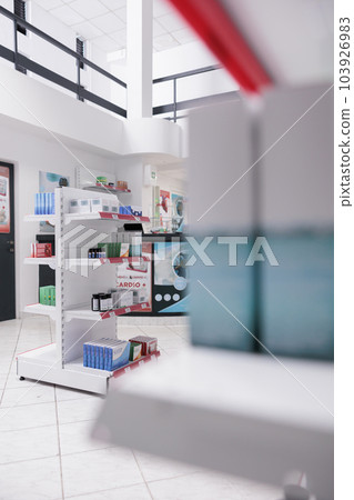 Drugstore shelves filled with pills and pharmaceutical products to sell prescription medicine or treatment to sick clients. Empty pharmacy with medication, supplements and drugs bottles. 103926983