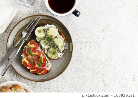 Healthy cucumber and tomato toast. 103929181