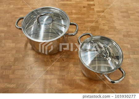 Pots on a kitchen counter 103930277