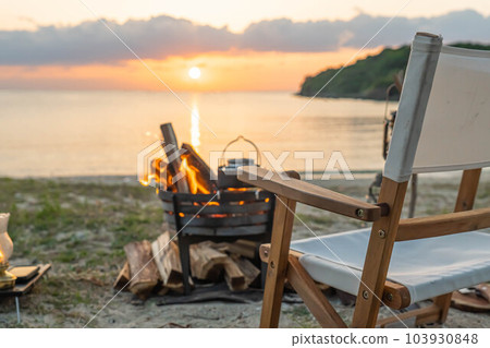 bonfire bonfire stand campfire flame shore sunset vacation sunset sunset 103930848