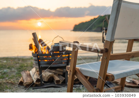 bonfire bonfire stand campfire flame shore sunset vacation sunset sunset 103930849