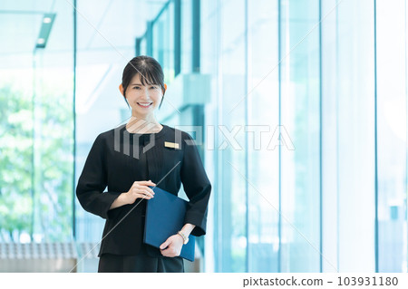 Hotel staff guiding guests Hotel staff guiding guests 103931180