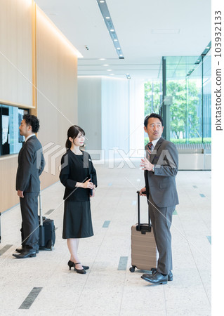 Hotel staff guiding guests Hotel staff guiding guests 103932133