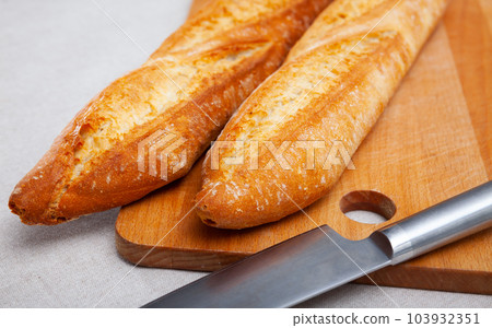 Image of crunchy homemade fresh baked baguettes Image of crunchy homemade fresh baked baguettes 103932351