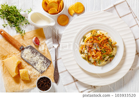 cheesy green bean casserole on plate, top view 103933520