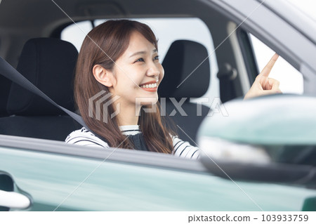 A woman driving a car A woman driving a car 103933759