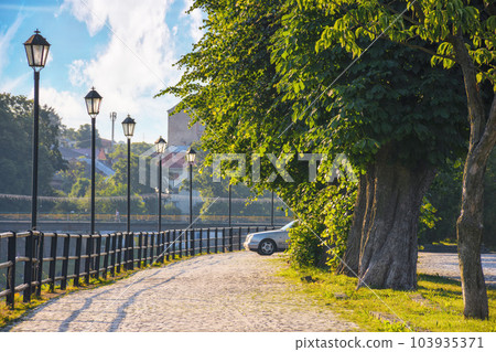 waterfront of the river uzh with lanterns. urban scenery at sunrise waterfront of the river uzh with lanterns. urban scenery at sunrise 103935371