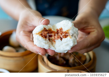 Steamed pork bun from the stove was hot. Steamed pork bun from the stove was hot. 103935627