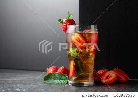 Cocktail with ice, mint, and strawberries. Cocktail with ice, mint, and strawberries. 103938559