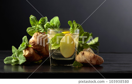 Cold refreshing drink with ice, ginger, lemon, and mint. Cold refreshing drink with ice, ginger, lemon, and mint. 103938580