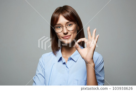 Smiling Happy Girl in glasses. Beautiful laughing Woman 103938626