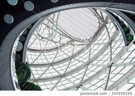 Glass cupola of Nur-Alem sphere in EXPO 2017 Exhibition Area. Futuristic Interior. Glass roof with solar panels, levels floors of round Sphere modern building. Astana Nur-Sultan, Kazakhstan Glass cupola of Nur-Alem sphere in EXPO 2017 Exhibition Area. Futuristic Interior. Glass roof with solar panels, levels floors of round Sphere modern building. Astana Nur-Sultan, Kazakhstan 103939199