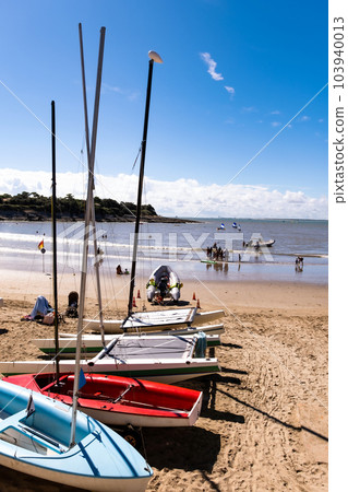 Colorful boats on beautiful sea beach in sunny day. Fishing and travel transportation ships on scenic seascape Colorful boats on beautiful sea beach in sunny day. Fishing and travel transportation ships on scenic seascape 103940013