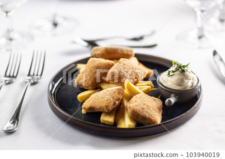 Kids menu ina fancy restaurant with chicken nuggets and potato wedges with mayonnaise Kids menu ina fancy restaurant with chicken nuggets and potato wedges with mayonnaise 103940019
