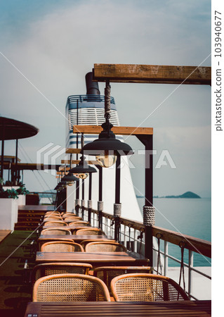Vintage lamps with table and armchair on the ferry outdoors. Vintage lamps with table and armchair on the ferry outdoors. 103940677